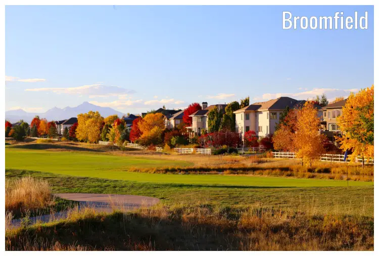 Neat and well-manicured lawns of a golf course in Broomfield, Colorado, colorful brown and golden trees amid classy homes during the fall Neat and well-manicured lawns of a golf course in Broomfield, Colorado, colorful brown and golden trees amid classy homes during the fall